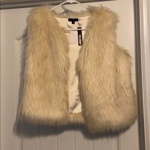 Cream colored faux fur vest